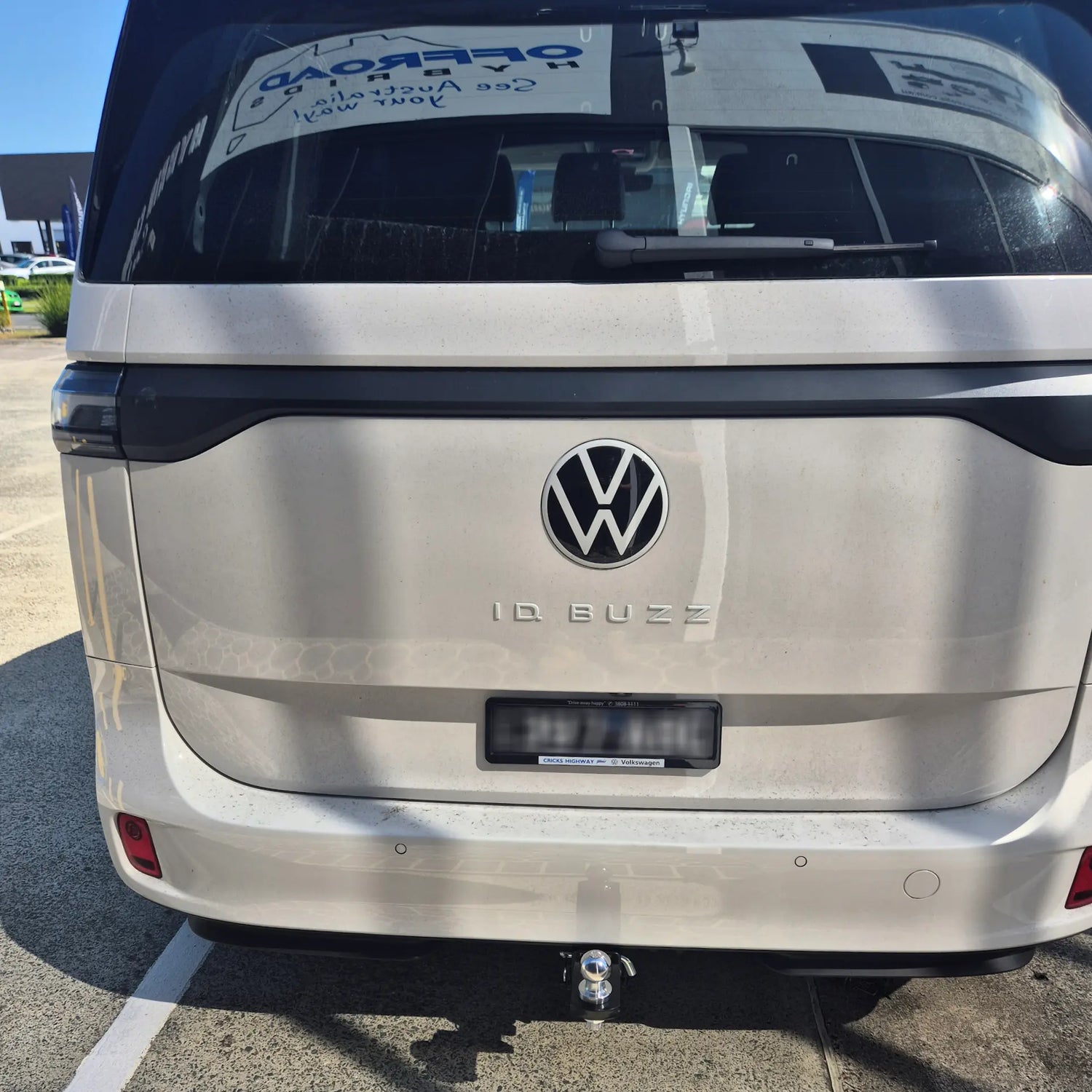 Back view of a Volkswagen ID Buzz electric vehicle with tow bar fitted