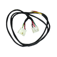 A direct fit wiring harness for a Ford Falcon FG Sedan, featuring two white connector plugs on the ends, surrounded by black insulation with visible colored wires.