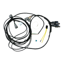 A direct fit wiring harness for Toyota Hilux Trayback, including various connectors and wiring, against a white background.