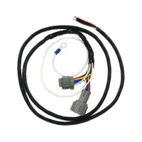 A coiled, black vehicle wiring harness with connectors, designed for Nissan Navara D22 Trayback.